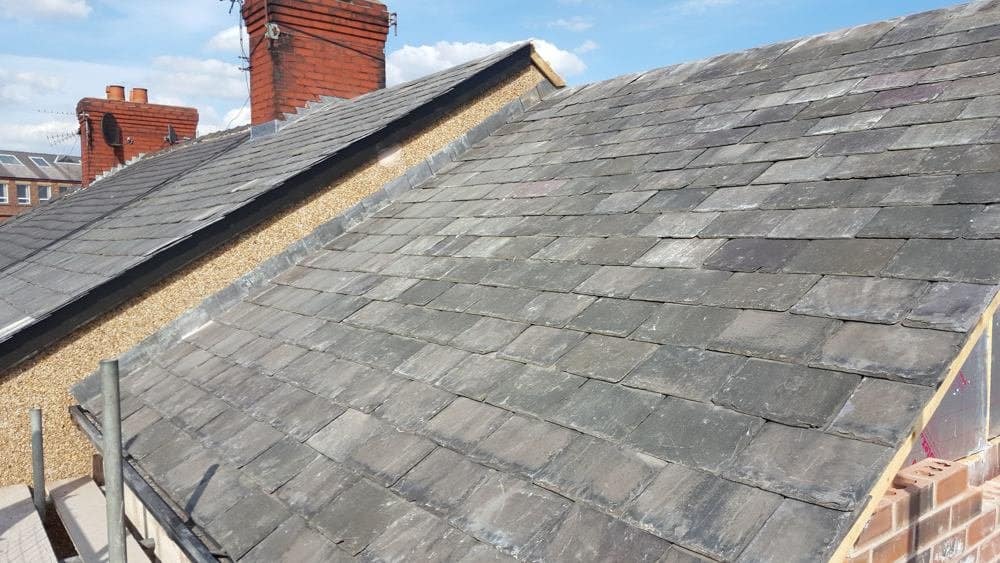 New slate roof installation on UK terraced house